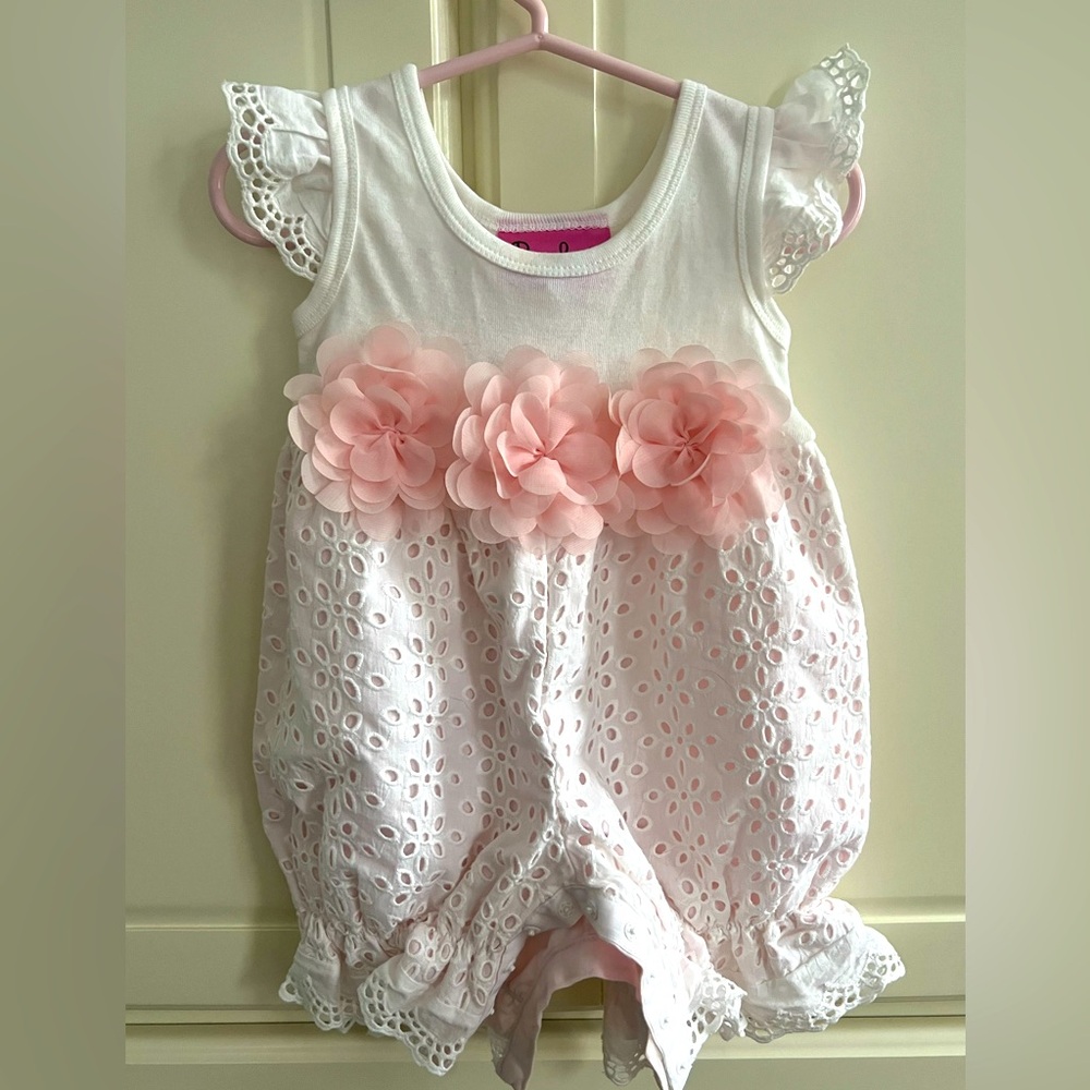 Beautiful little girls one piece eyelet romper to wear for any special occasion.